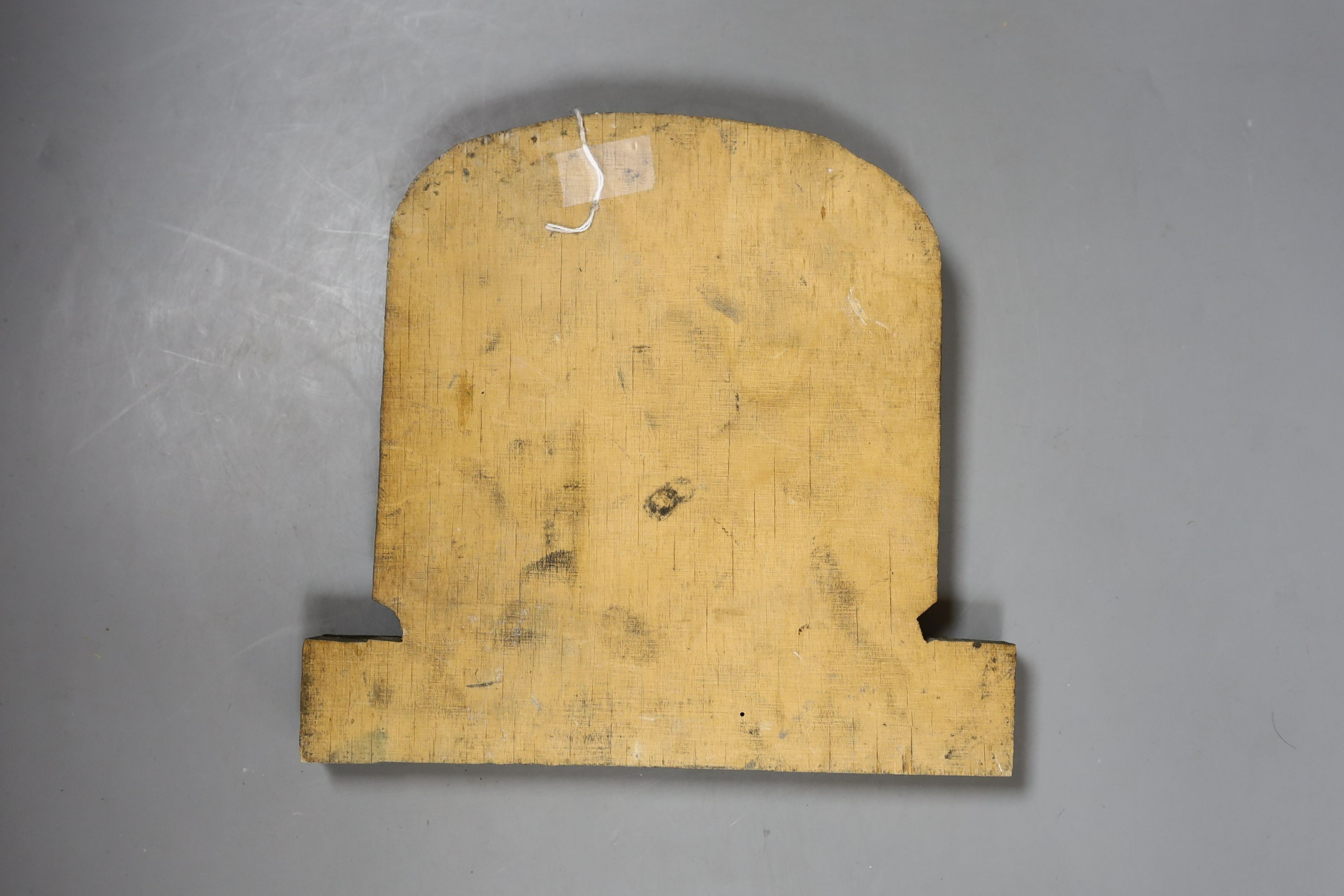 A 19th century copper fire mark, later painted, mounted on cut wood. 23cm long